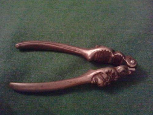 Late Victorian bronzed iron Crowned Lion Head Nutcrackers.jpeg